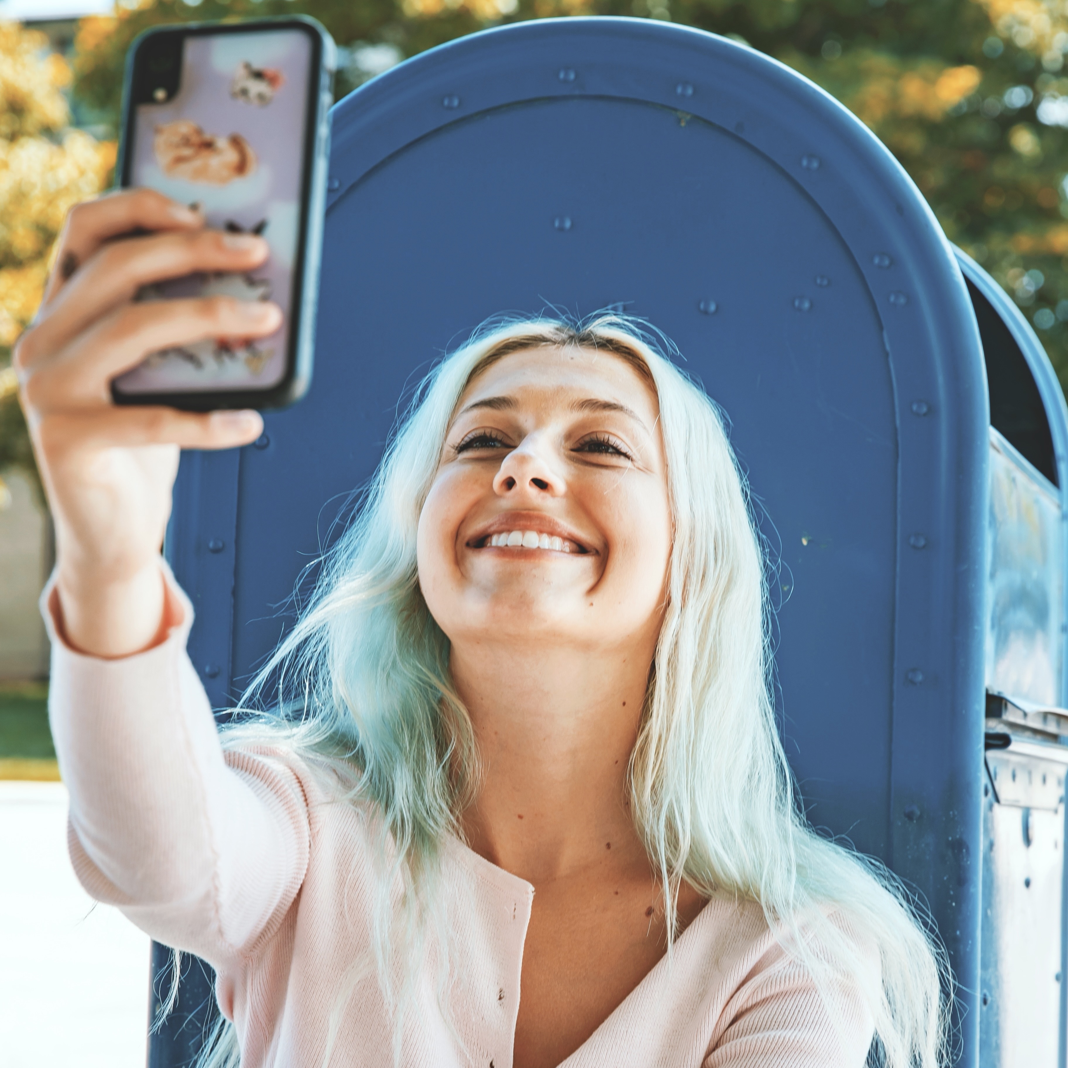 girl-taking-selfie-with-phone